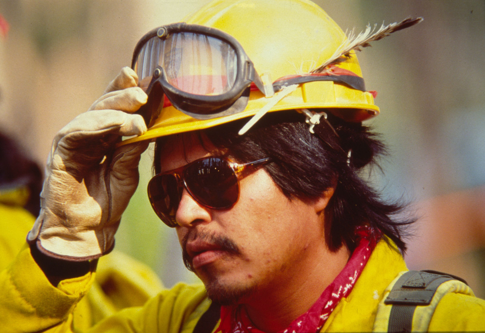 A firefighter listens to a morning briefing